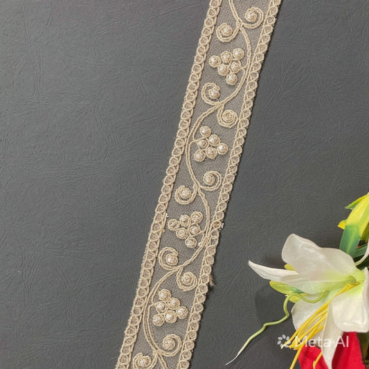 Decorative lace trim on a dark background with flowers in the corner